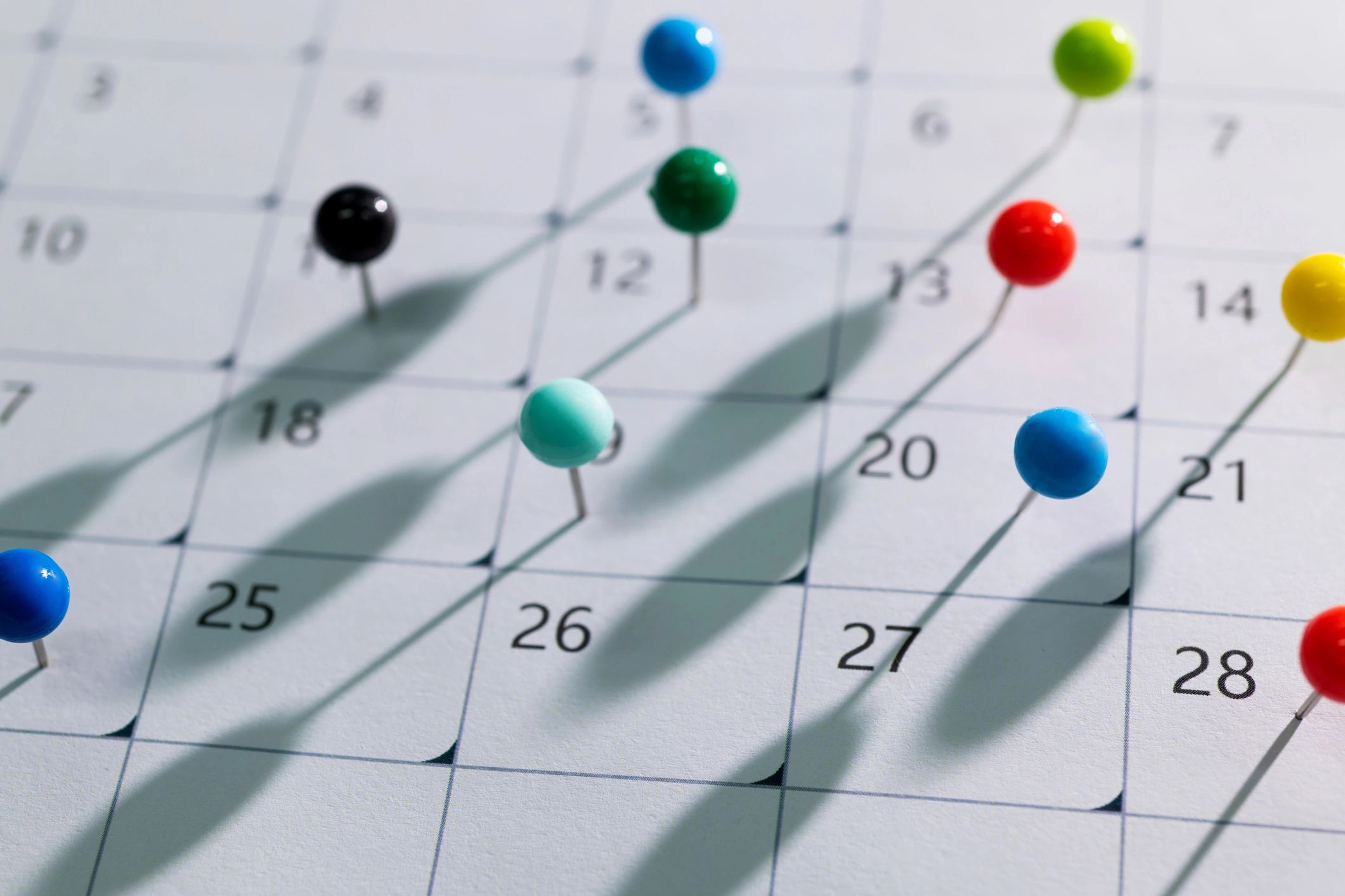 Calendar with colored pins for schedule planning