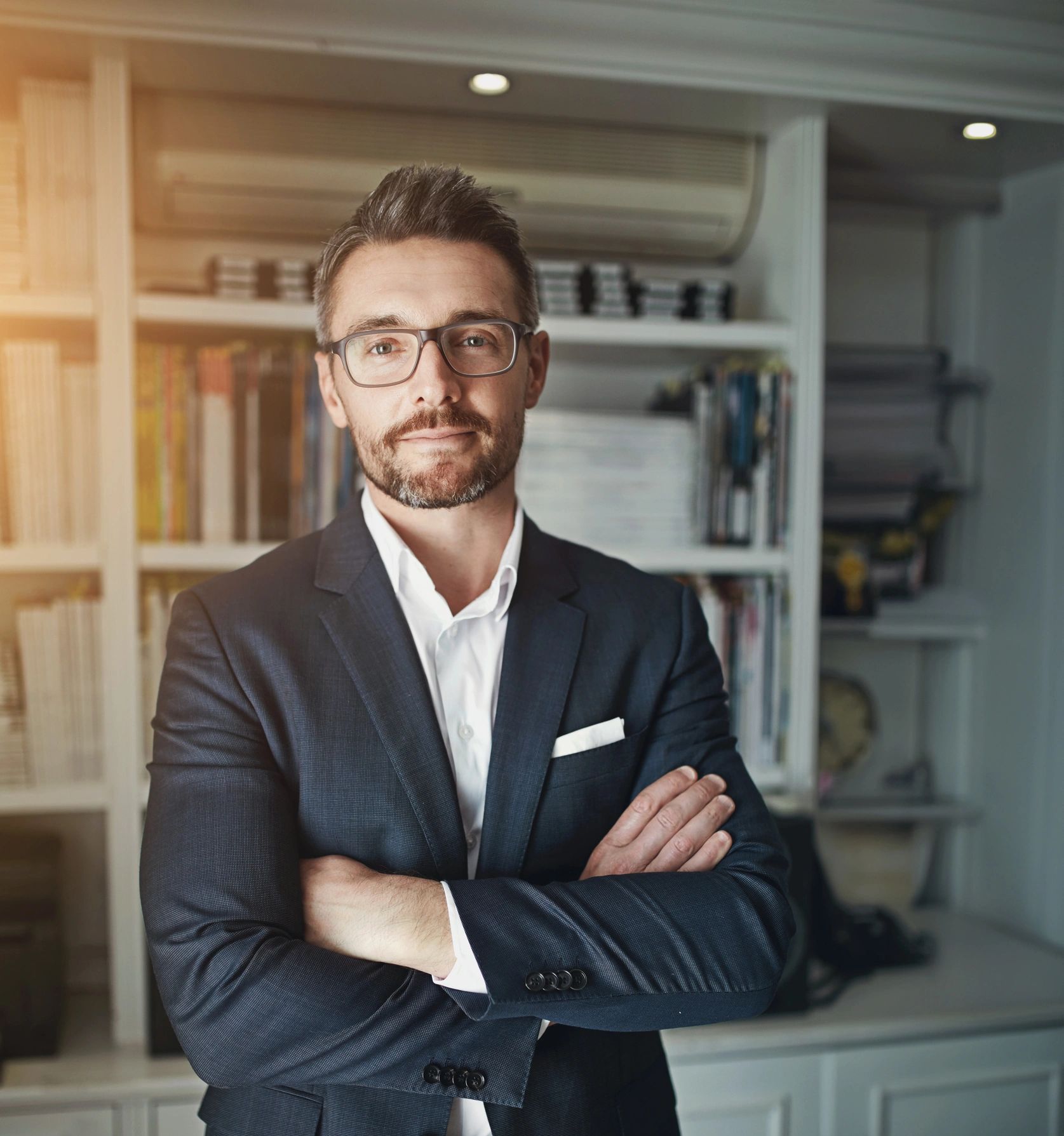 Professional man with arms crossed in an office