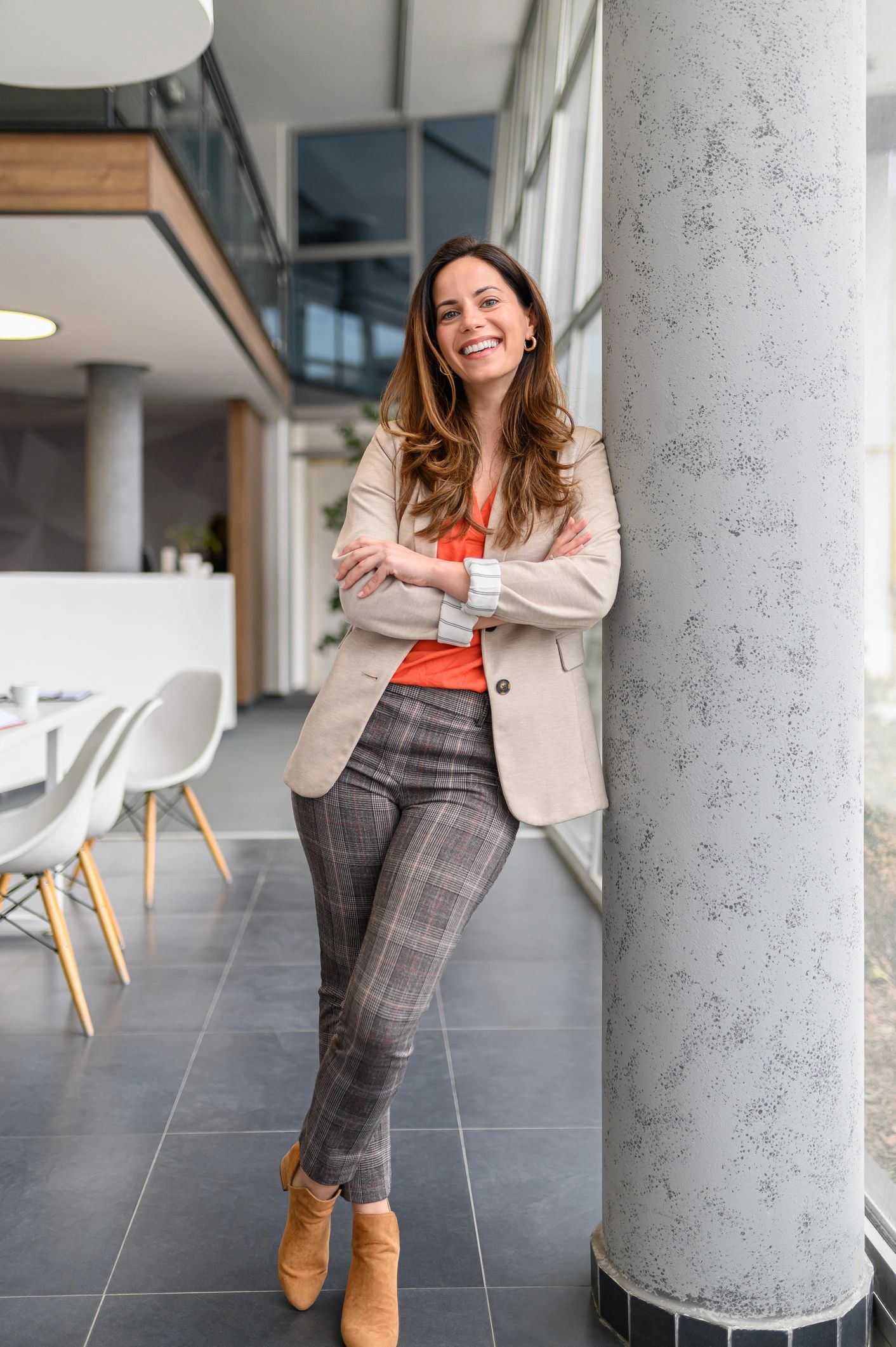 Female manager posing confidently in an office