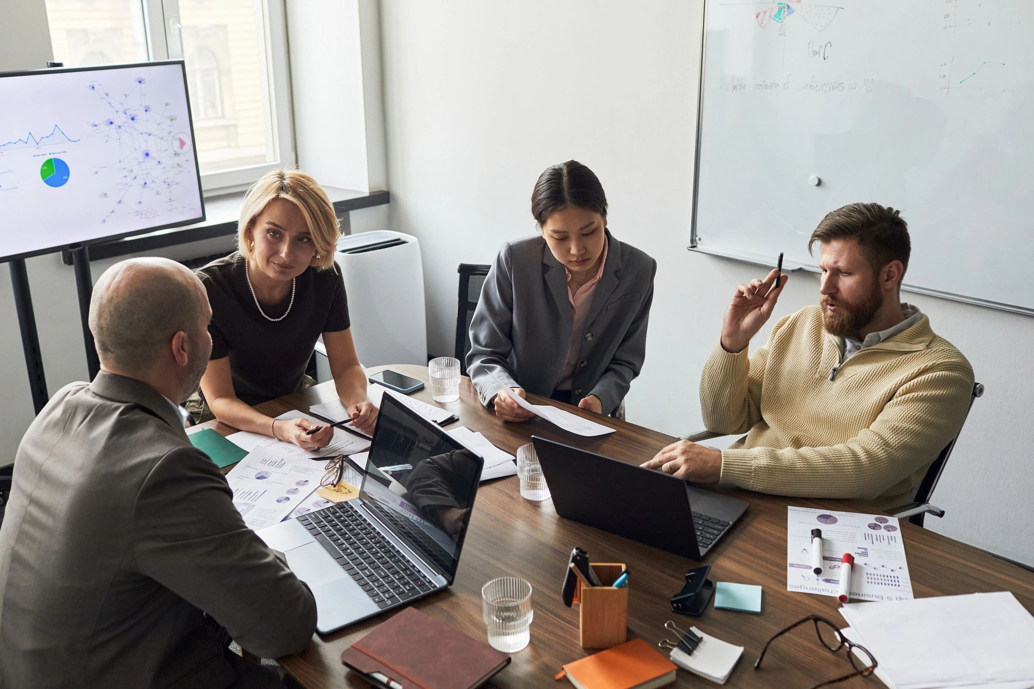 Business team reviewing analytics and reports during a strategy meeting